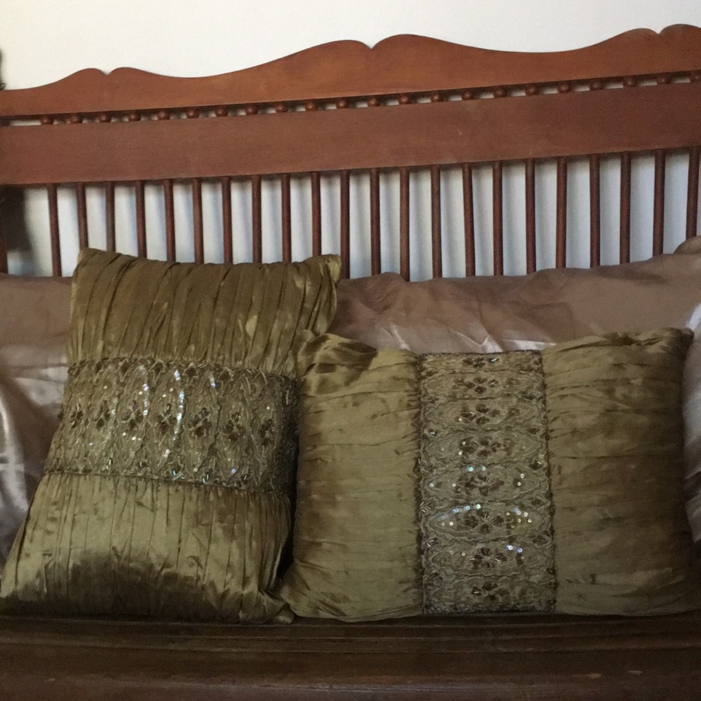 Two sequined decorative pillows